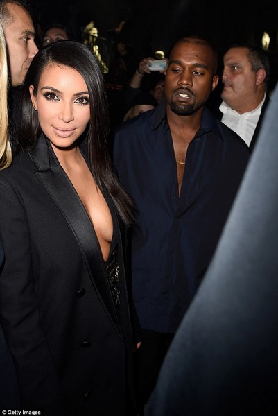 Kim Kardashian appears topless under open tuxedo jacket  